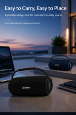 AEMAI B13 portable speaker placed on home office desk setup with laptop and workspace accessories
